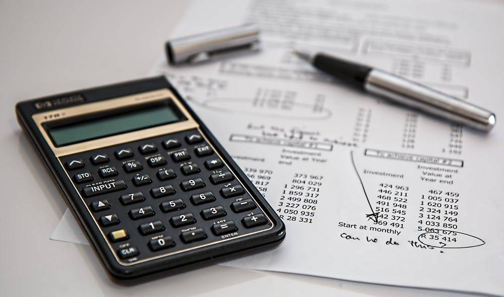 Calculator and a sheet of finances