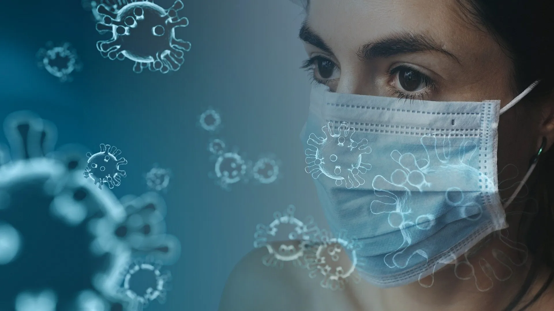 covid graphic - woman wearing a facemask with coronavirus particles