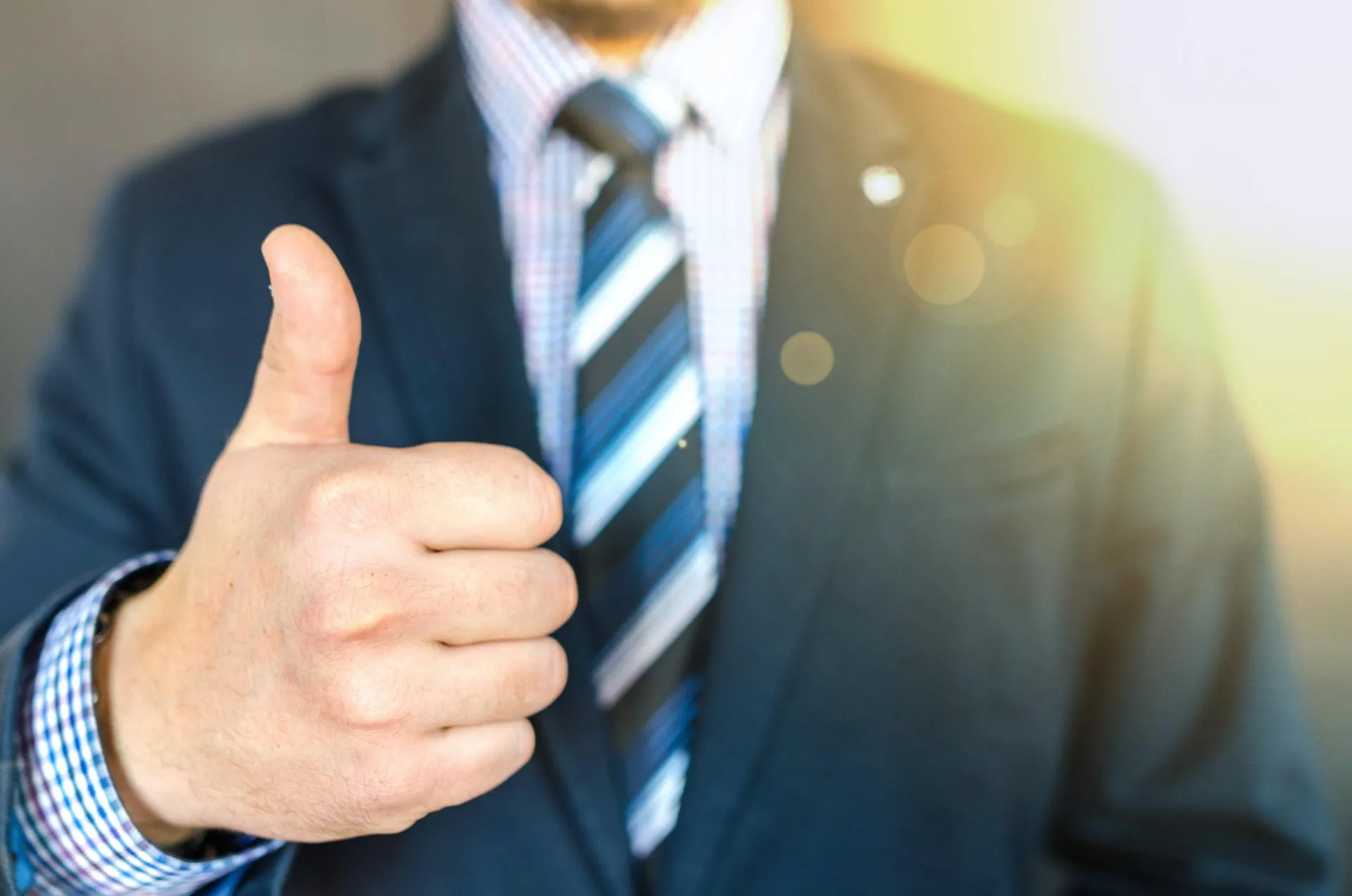 professional giving a thumbs up to the camera